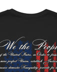 rear view closeup of black colored fabric patriotic shirt with American flag background and the preamble of the united states constitution on the back pf shirt, front of shirt has americantees.us logo