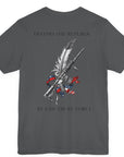 Back view of a white colored t-shirt with a graphic design of a rifle crossed with a quill fountain pen and an American flag ribbon, with the quote Defend the Republic by law or by force. Patriotic Shirts. logo design on front.