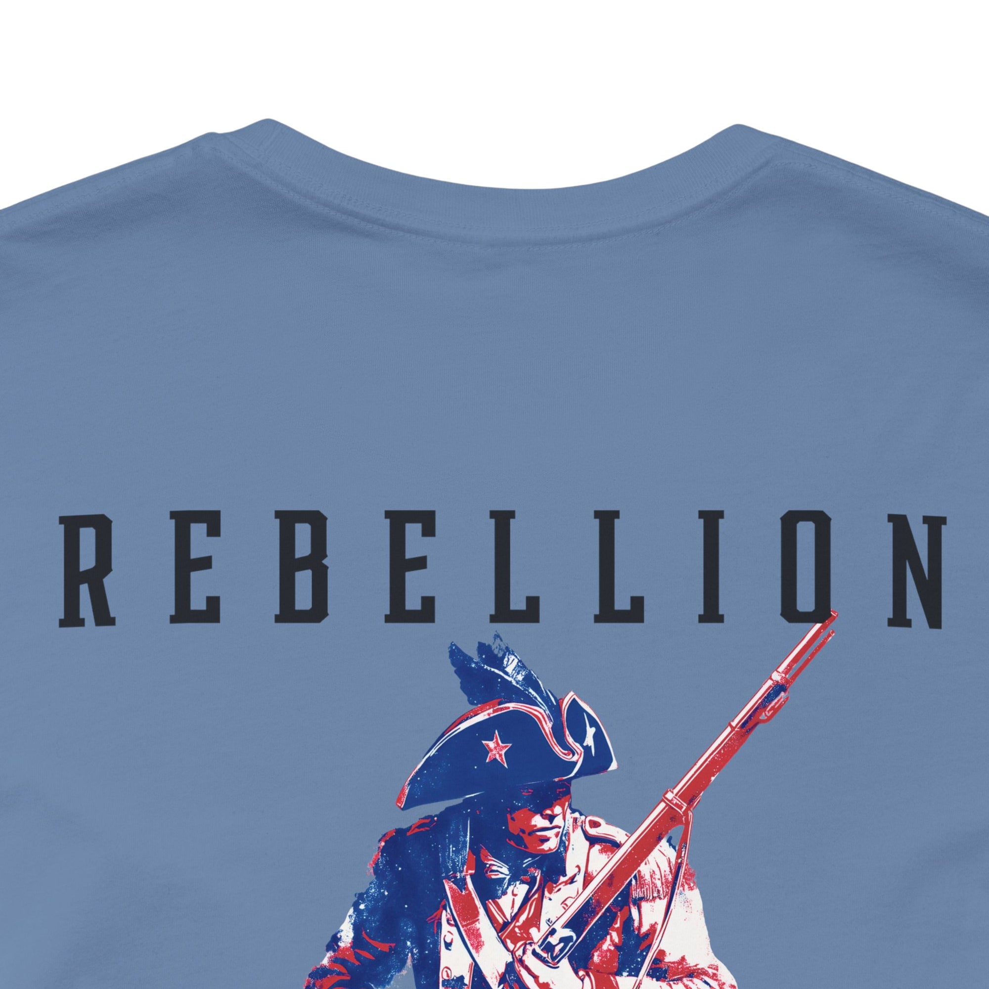 patriotic shirt rear view closeup lavender blue color fabric logo on front graphic on back with minuteman soldier and phrase rebellion is our heritage, American t-shirt