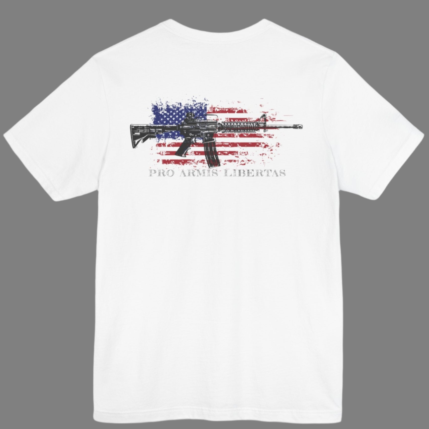 White color fabric patriotic shirt rear view has an americantees.us logo with eagle head on front , rear view has distressed American flag with modern sporting rifle with the log Pro Armis Libertas meaning For Arms, Freedom
