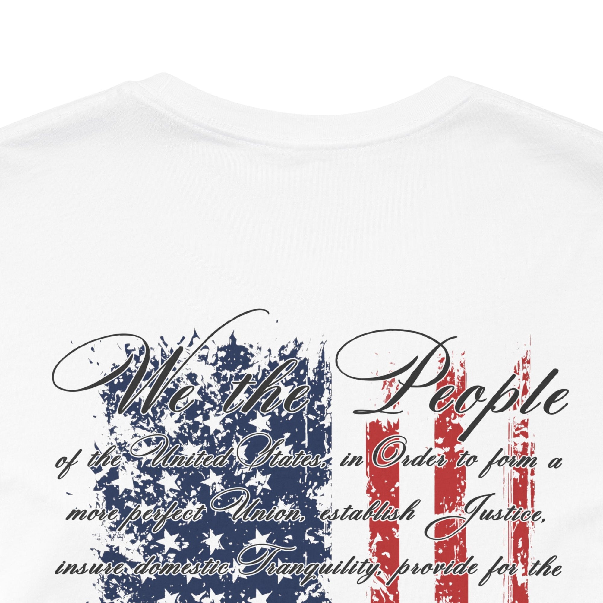 rear view closeup of white colored fabric patriotic shirt with American flag background and the preamble of the united states constitution on the back pf shirt, front of shirt has americantees.us logo
