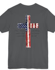 rear view of an asphalt colored fabric patriotic shirt with americantees.us logo on front and American flag in shape of a Christian cross with pledge of allegiance surrounding image on back