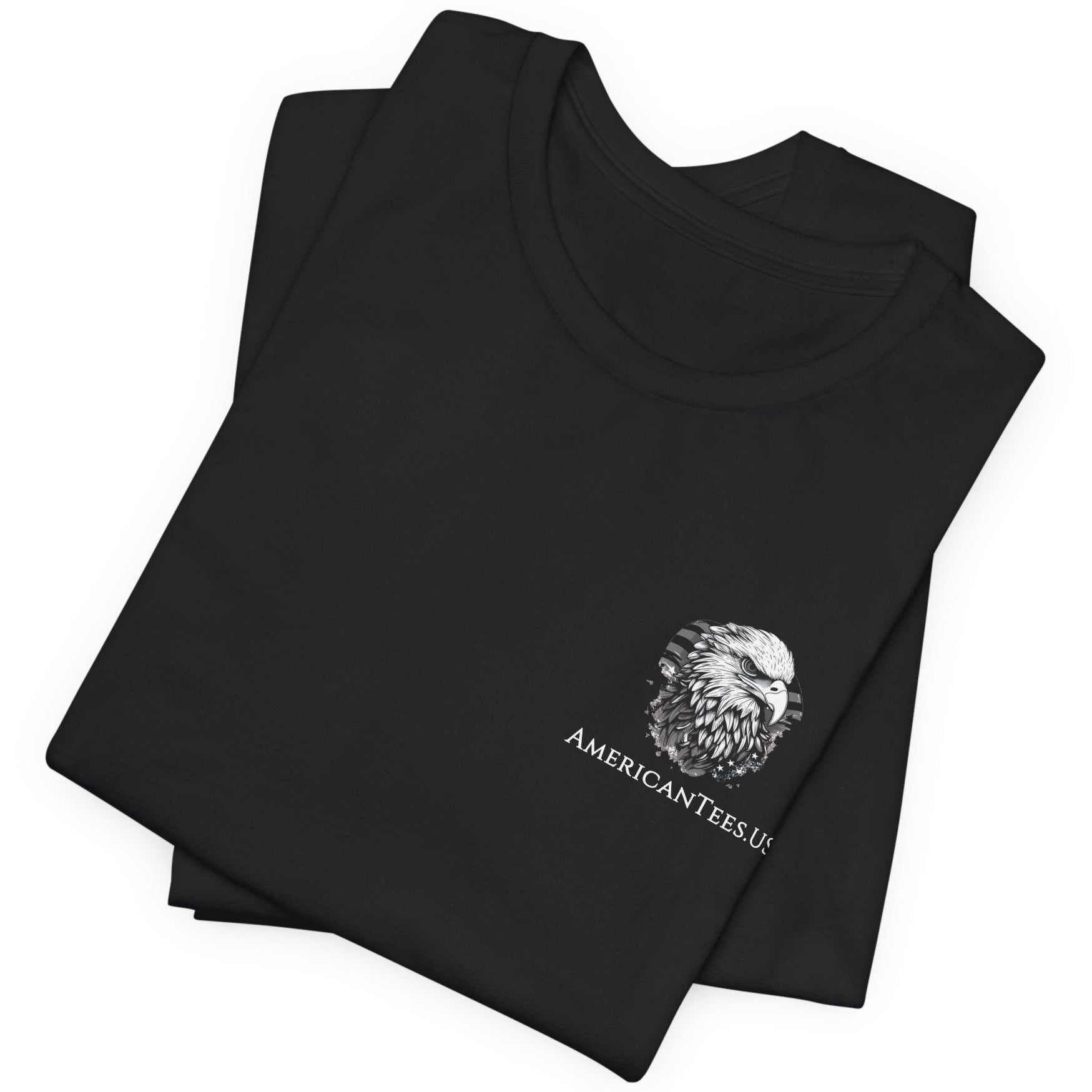 front view of black color fabric folded patriotic shirt with americantees.us logo on front and Thomas Jefferson quote on back.