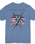 lavender blue colored t-shirt featuring two crossed swords in front of a full-color American flag graphic, with the text "Ius Populi ad Arma" in bold black font above. back view