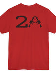 rear view of a patriotic a red colored fabric shirt with americantees.us logo on front and 2A on the back with stacked rifles forming the A