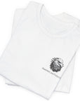 Front view of a folded white colored t-shirt with a graphic design of a rifle crossed with a quill fountain pen and an American flag ribbon, with the quote Defend the Republic by law or by force. Patriotic Shirts. logo design on front