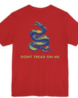 rear view of a red colored fabric shirt with americantees.us logo on front and a Gadsden flag on the back