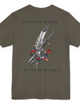 Back view of an army green colored t-shirt with a graphic design of a rifle crossed with a quill fountain pen and an American flag ribbon, with the quote Defend the Republic by law or by force. Patriotic Shirts. logo design on front.