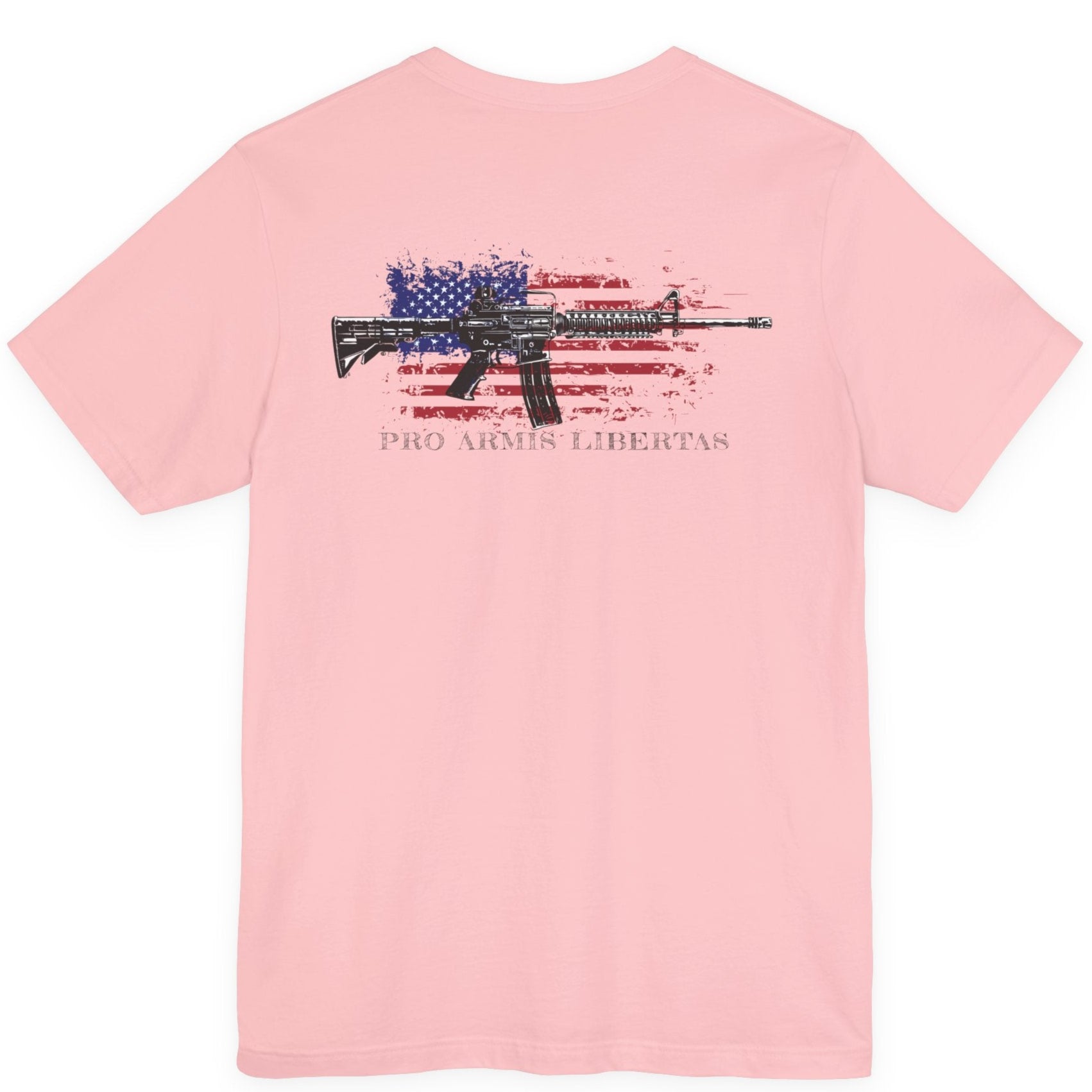 Pink color fabric patriotic shirt rear view has an americantees.us logo with eagle head on front , rear view has distressed American flag with modern sporting rifle with the log Pro Armis Libertas meaning For Arms, Freedom
