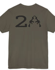 rear view of a patriotic army green colored fabric shirt with americantees.us logo on front and 2A on the back with stacked rifles forming the A
