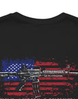 Black color fabric patriotic shirt closeup view has an americantees.us logo with eagle head on front , rear view has distressed American flag with modern sporting rifle with the log Pro Armis Libertas meaning For Arms, Freedom