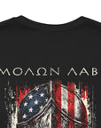 front view close-up black color fabric tee with americantees.us logo on front with spartan helmet covered with american flag and motto molon labe patriotic shirt