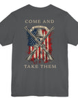 rear view of patriotic shirt asphalt color fabric tee with logo on front and american flag with liberty bell and crossed rifles on back, motto that states Come and Take Them and molon labe on scroll