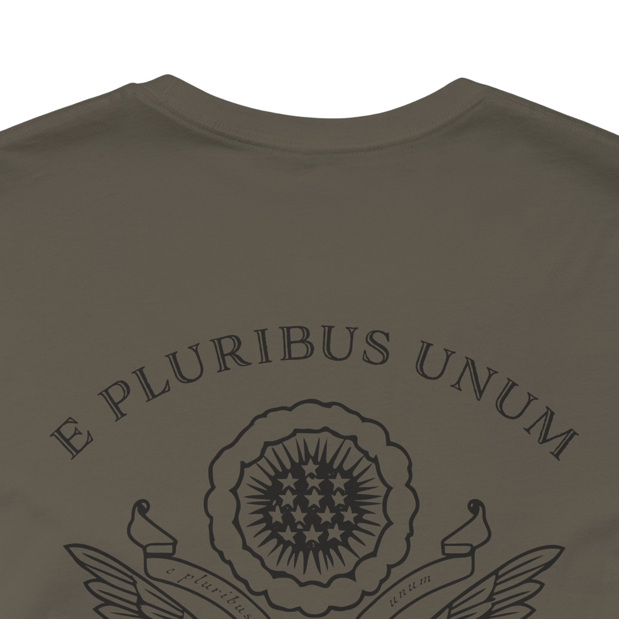 rear view closeup of a army green colored fabric patriotic shirt with an americantees.us logo on front and the great seal of the united states on the back