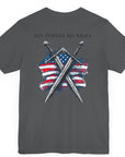 asphalt colored t-shirt featuring two crossed swords in front of a full-color American flag graphic, with the text "Ius Populi ad Arma" in bold black font above. back view