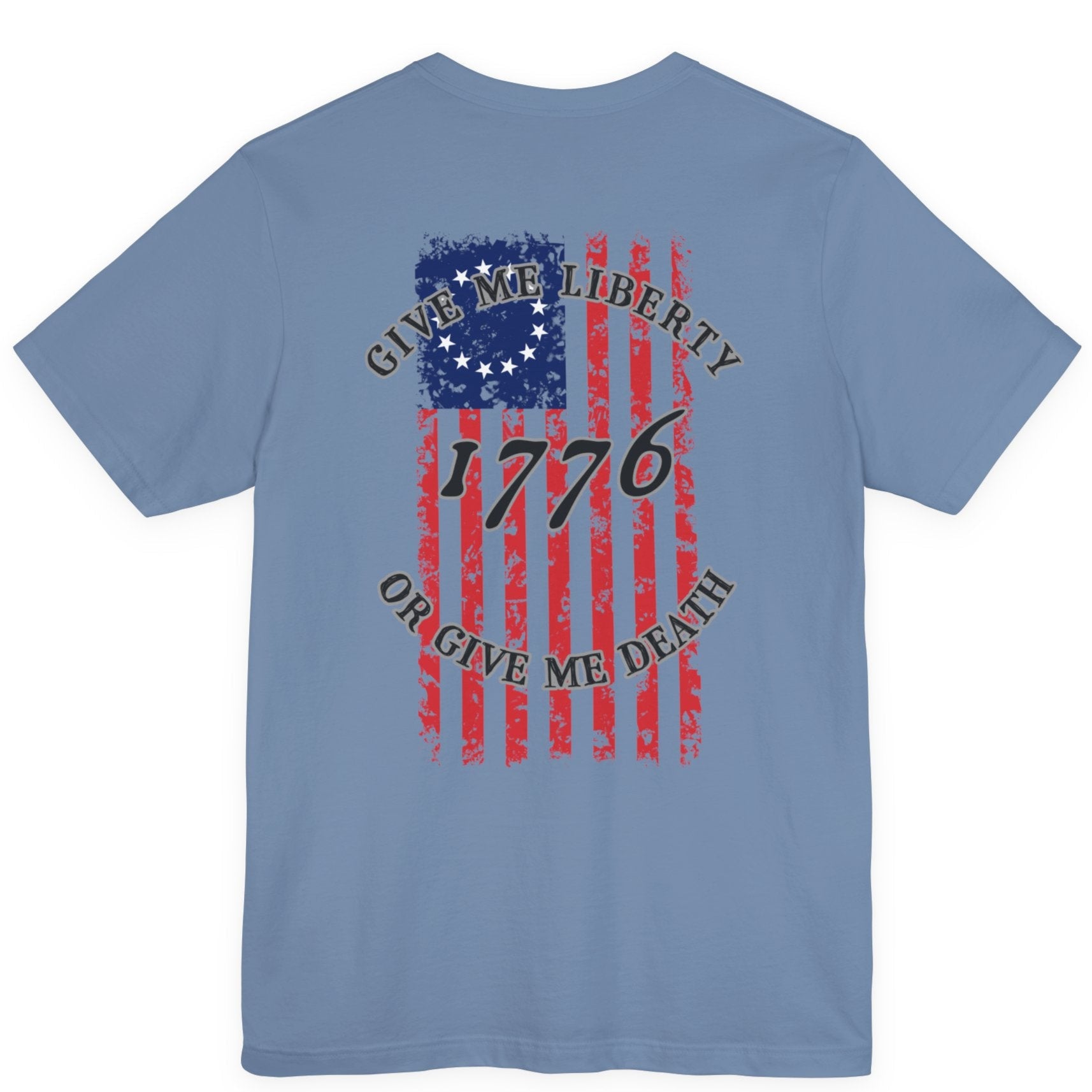 rear view of a steel blue colored fabric shirt with americantees.us logo on front and betsy ross flag with the phrase give me liberty or give me death and 1776 on the back