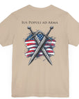 tan colored t-shirt featuring two crossed swords in front of a full-color American flag graphic, with the text "Ius Populi ad Arma" in bold black font above. back view