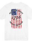 rear view of a white colored fabric shirt with americantees.us logo on front and betsy ross flag with the phrase give me liberty or give me death and 1776 on the back