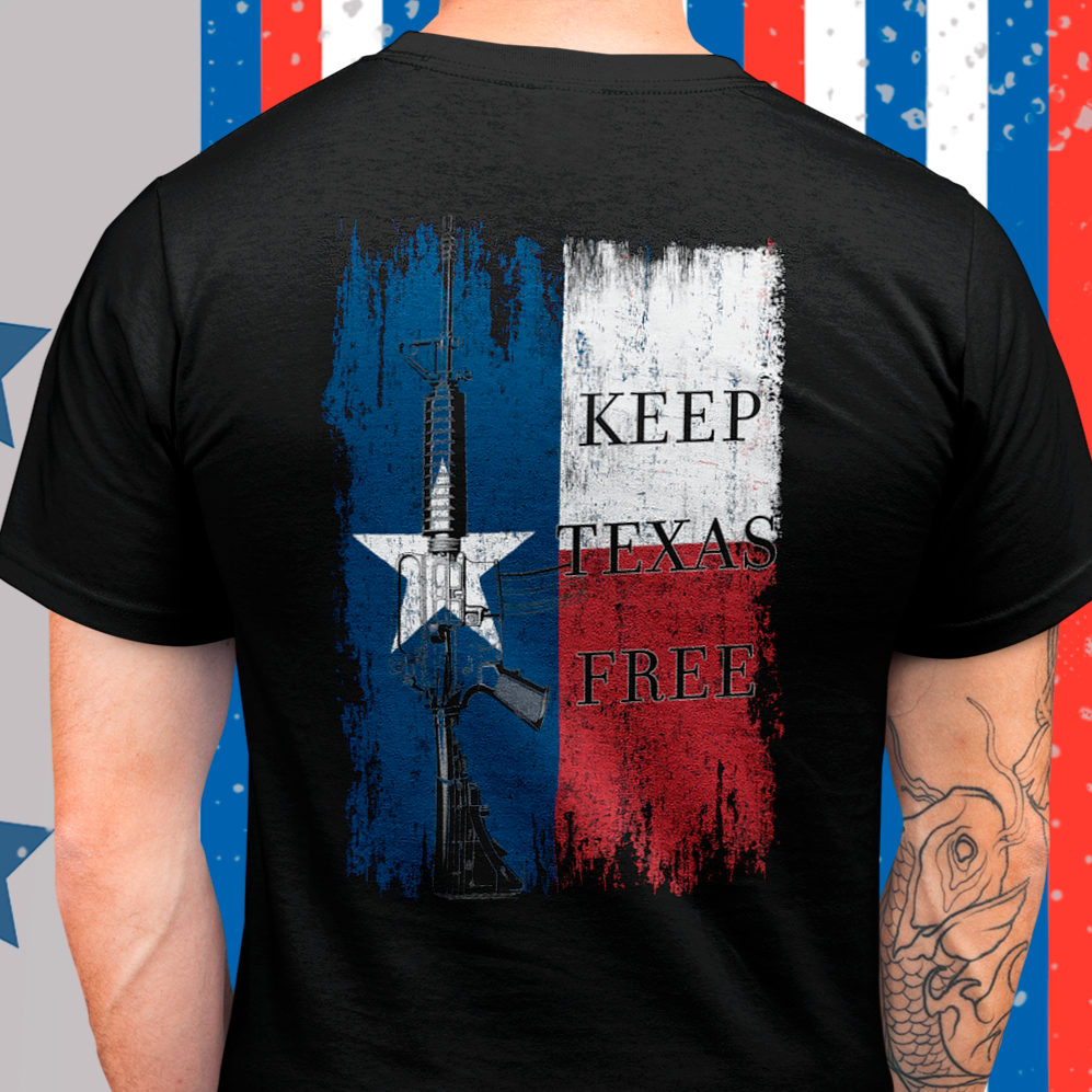 rear view of a man wearing a  black colored fabric shirt standing in front of an american ribbon with americantees.us logo on front and Texas flag with rifle and Keep Texas Free writing on back