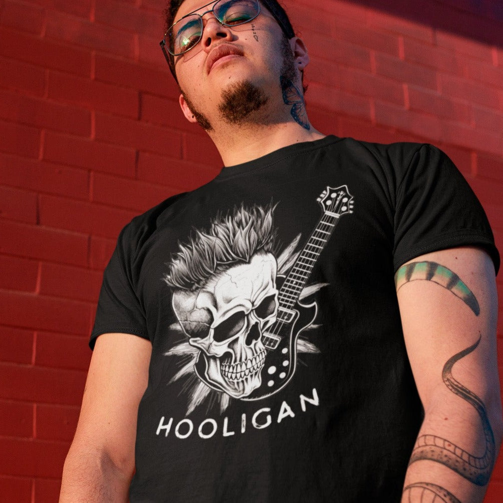 boneyard-ballad-punk-rock-black-t-shirt-mockup-of-a-tough-looking-man-posing-in-front-of-a-red-brick-wall