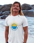 high-tides-and-good-vibes-white-t-shirt-beach-sunset-unisex-mockup-of-a-blonde-long-haired-man-barefoot-at-the-beach