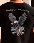 Patriotic Shirts man wearing a Pro Libertas Semper Flag Eagle Tee, black color, back side, featuring a bold eagle clutching an American flag with scrollwork on a unisex 100% cotton shirt, ideal for American pride