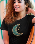 moonlit-charm-black-t-shirt-crescent-moon-with-hanging-stars-mockup-of-a-woman-taking-the-subway-to-go-home