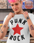 punk-rock-red-star-white-t-shirt-mockup-featuring-a-man-with-pink-hair-at-a-music-store