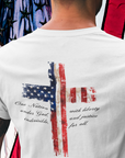 rear view of a man wearing a white colored fabric patriotic shirt with American flag in shape of a Christian cross with pledge of allegiance surrounding image