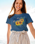 a-good-heart-keeps-you-beautiful-heather-true-navy-t-shirt-womens-sunflower-mockup-featuring-a-smiling-woman-posing-on-a-yacht
