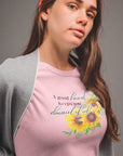 a-good-heart-keeps-you-beautiful-pink-t-shirt-womens-sunflower-mockup-of-a-pretty-woman-in-a-grey-room
