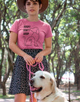 adopt-dont-shop-charity-pink-t-shirt-with-dog-graphic-unisex-mockup-of-a-girl-wearing-a-tee-with-her-dog-at-the-park
