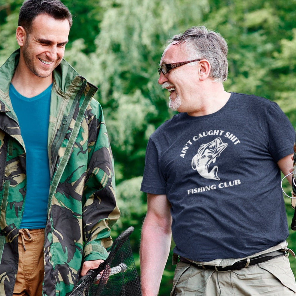 aint-caught-shit-fishing-club-navy-blue-t-shirt-mens-sports-mockup-of-two-men-gone-fishing