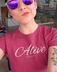 alive-out-of-spite-berry-t-shirt-funny-mockup-of-a-tattooed-woman-with-sunglasses-taking-a-selfie
