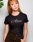 alive-out-of-spite-black-t-shirt-funny-beautiful-woman-wearing-a-round-neck-tshirt-mockup-near-plants