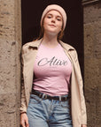 alive-out-of-spite-pinkt-shirt-funny-mockup-featuring-a-woman-outside-a-stone-church
