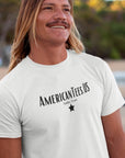 americantees-us-austin-tx-white-t-shirt-unisex-mockup-of-a-cool-man-wearing-a-tee-on-the-beach