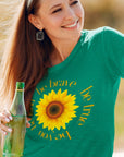 be-true-be-you-be-kind-be-brave-heather-kelly-t-shirt-sunflower-womens-mockup-of-a-smiling-woman-leaning-on-a-car