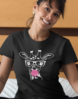 bubblegum-giraffe-black-t-shirt-womens-style-happy-woman-wearing-a-tee-mockup-on-bed-with-her-cat
