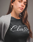 classy-until-tip-off-black-t-shirt-basketball-womens-partial-side-tee-mockup-of-a-pretty-woman-in-a-grey-room
