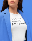 created-with-a-purpose-white-t-shirt-mockup-featuring-a-serious-looking-woman-at-a-studio