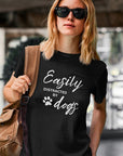 easily-distracted-by-dogs-black-t-shirt-womens-animal-lover-mockup-featuring-a-cool-woman-in-an-urban-setting