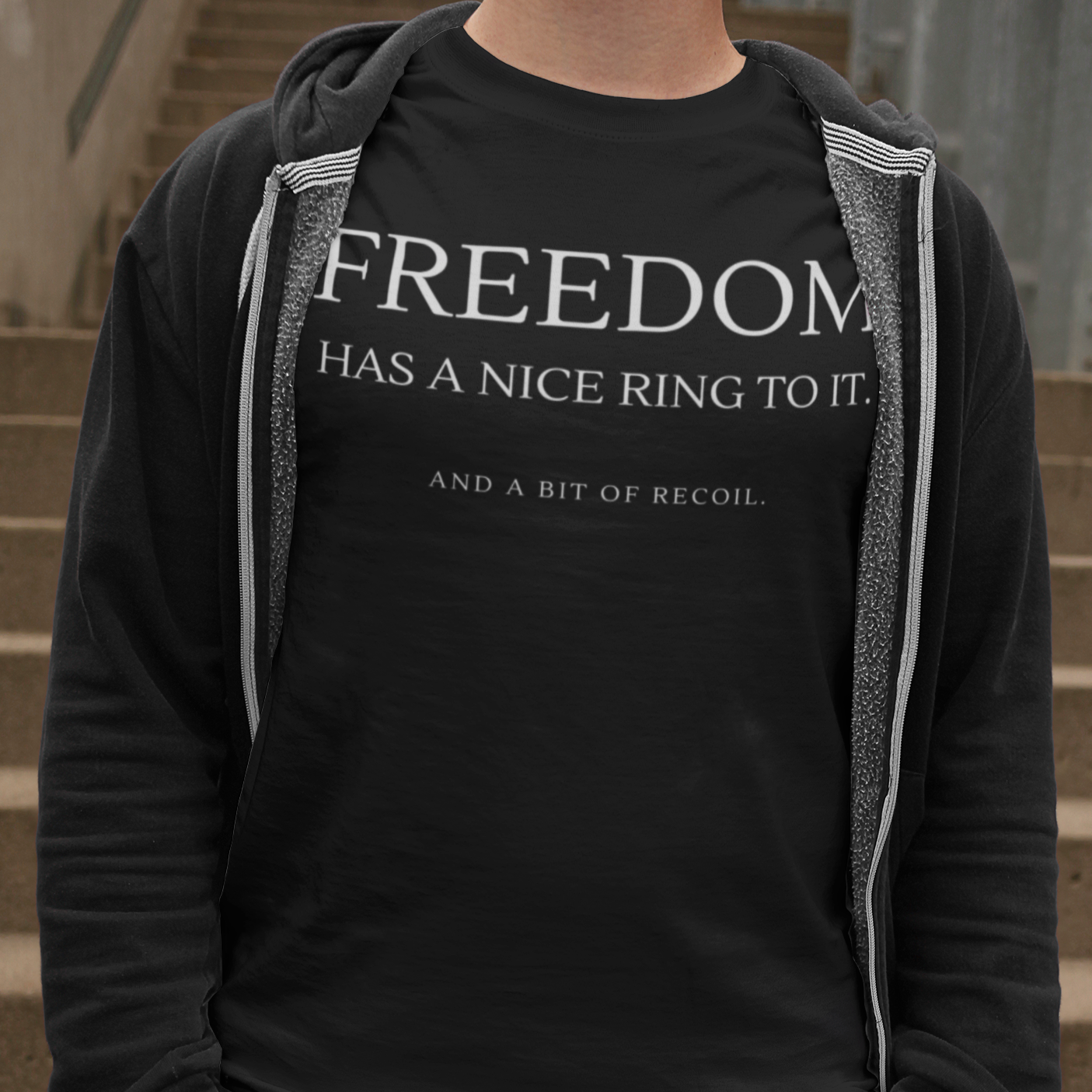 freedom-has-a-nice-ring-to-it-and-a-bit-of-recoil-black-t-shirt-2a-mockup-of-a-man-casually-standing