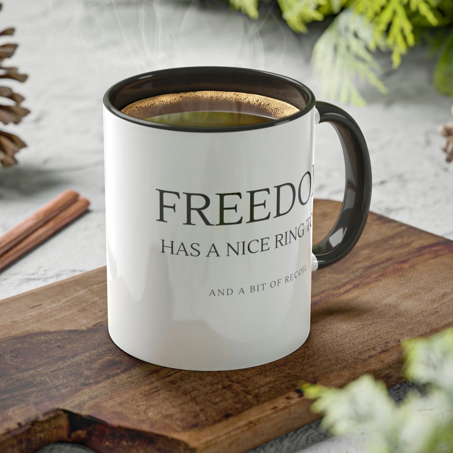 freedom-has-a-nice-ring-to-it-and-a-bit-of-recoil-glossy-mug-11-oz-2a-mockup-on-a-cutting-board