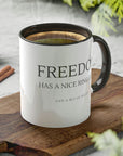 freedom-has-a-nice-ring-to-it-and-a-bit-of-recoil-glossy-mug-11-oz-2a-mockup-on-a-cutting-board