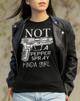 gun-girl-not-a-pepper-spray-kind-of-girl-black-t-shirt-mockup-featuring-a-young-woman-with-a-cool-vibe