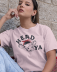 herd-ya-pink-t-shirt-cowgirl-mockup-of-a-trendy-woman-wearing-a-unisex-tee-and-distressed-jeans