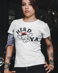 herd-ya-white-t-shirt-cowgirl-mockup-featuring-a-biker-woman-with-multiple-tattoos