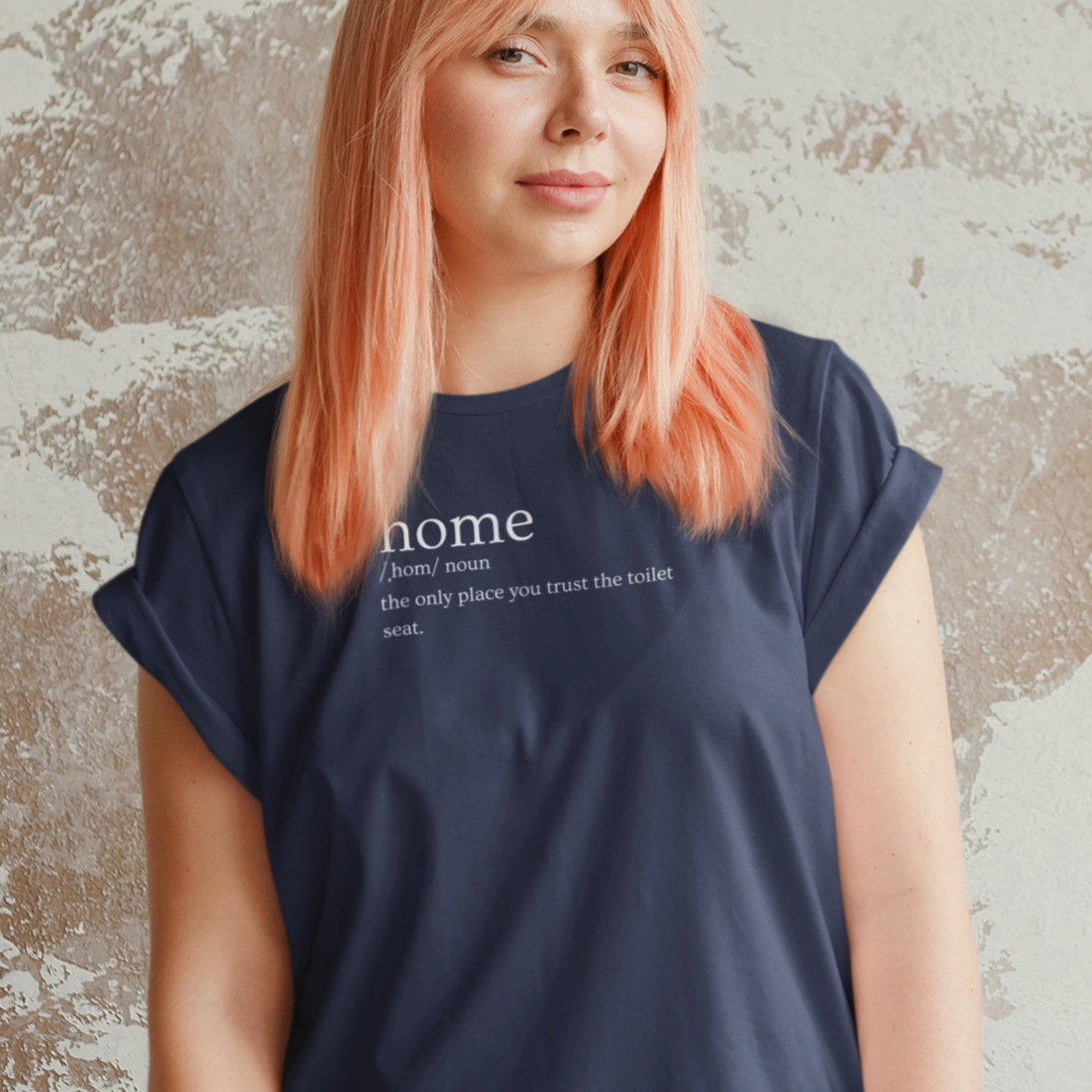 home-the-only-place-you-trust-the-toilet-seat-navy-t-shirt-mockup-of-a-pink-haired-woman-posing-in-front-of-a-wall