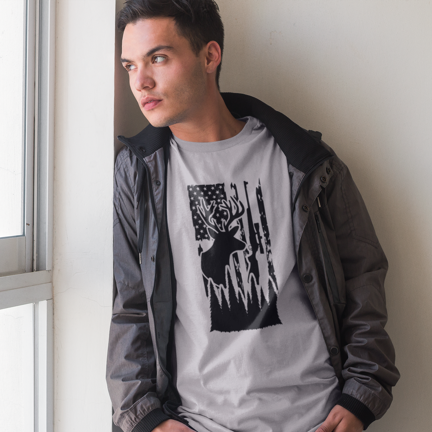 hunters-flag-athletic-heather-grey-shirt-hunting-mockup-of-a-young-man-looking-out-the-window
